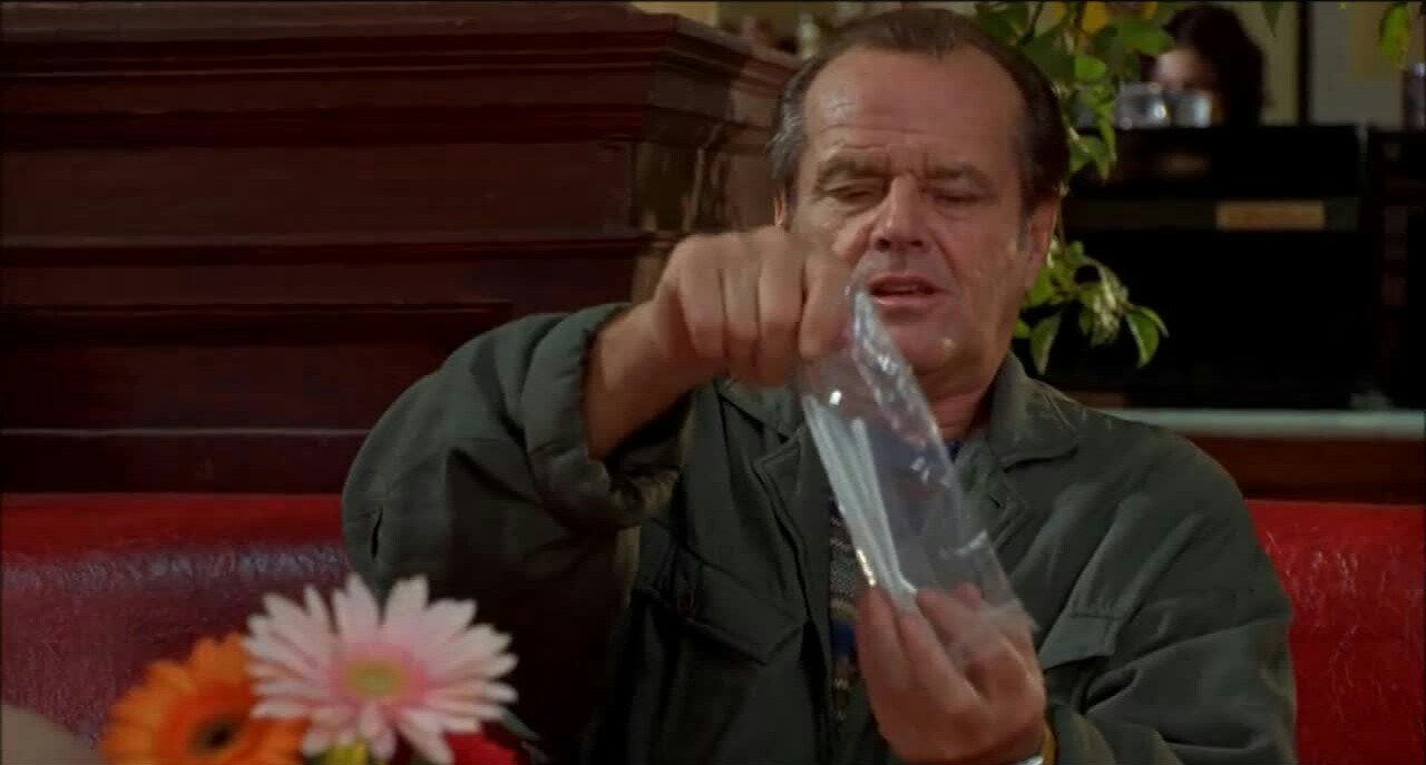 Jack Nicholson in As Good As It Gets. His character sits at a restaurant table and removes plastic cutlery from a bag.
