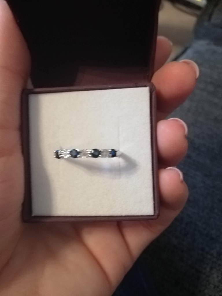 A close up of my ring from Liam - a white gold band with alternating diamonds and saphires