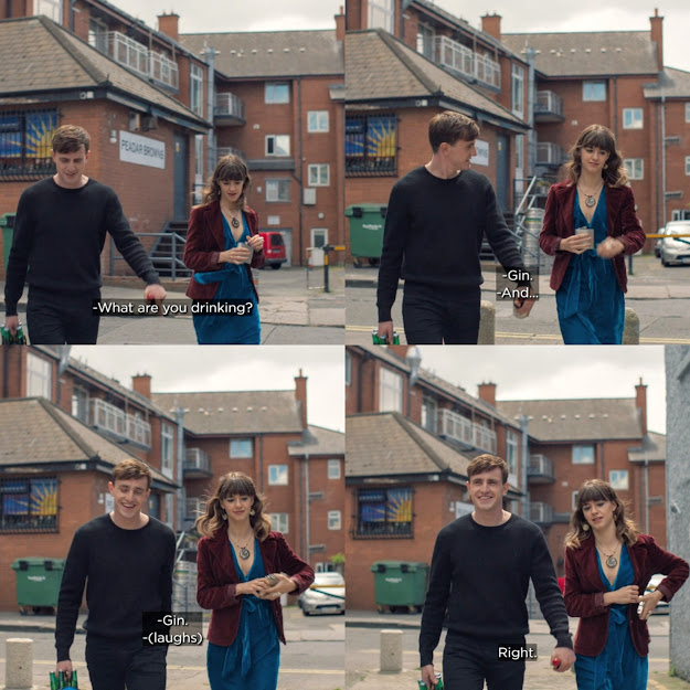 Still of Marianne and Connell walking together. Marianne takes a drink from a hip flask. Connell asks "What are you drinking?" She replies "Gin." He responds with "And...?" to which she immediately replies with "Gin." Connell laughs and says "Right." Marianne puts the hip flask back in her pocket.