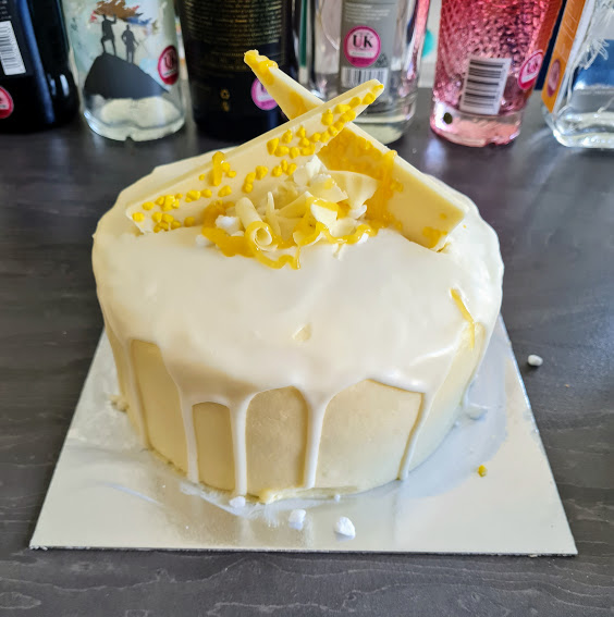 My birthday cake - lemon buttercream on the outside topped with white chocolate, lemon sauce and meringue pieces.
