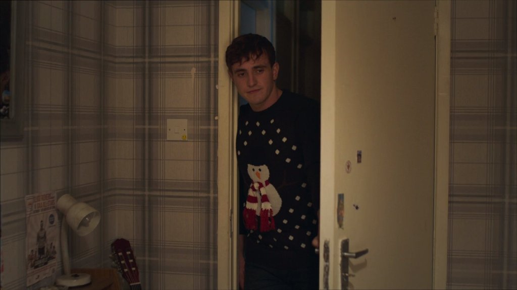 Screen grab of Connell wearing his snowman Christmas jumper.