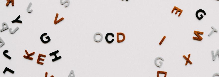 OCD spelt out on a white background with multicoloured letters surrounding it