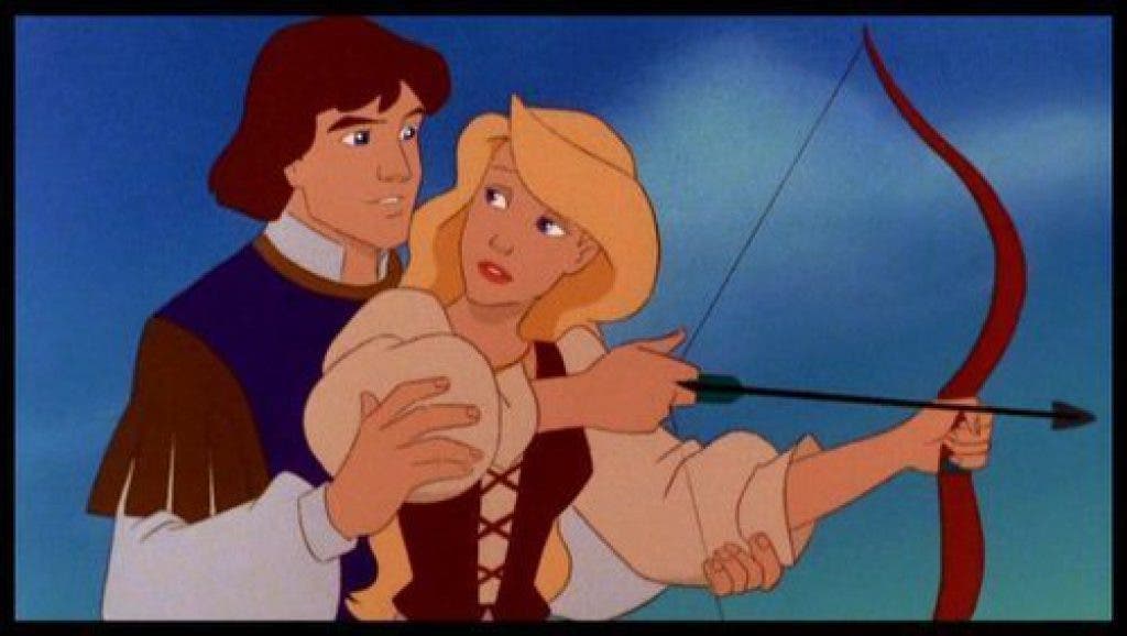 Odette prepares to fire a bow and arrow, while Derek stands behind her and gazes at her.