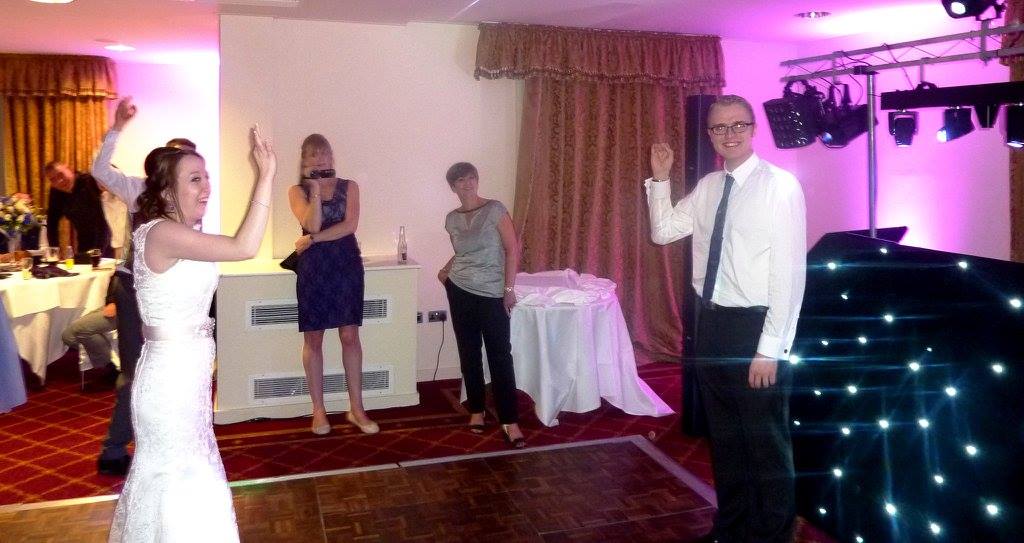 Dancefloor photo from my wedding. Me and Simon stand opposite each other dancing to Torn by Natalie Imbruglia.