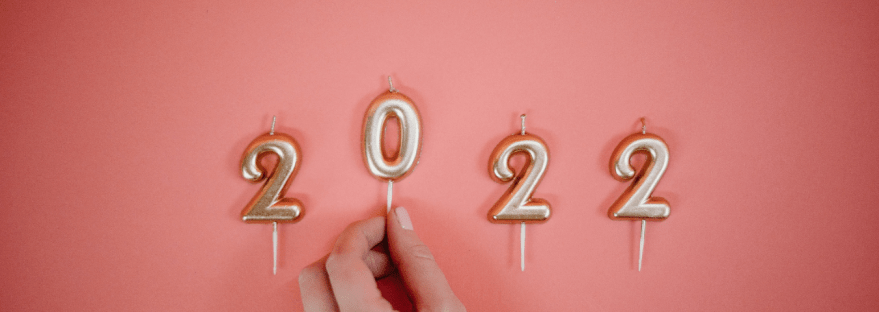 2022 Candles against pink background