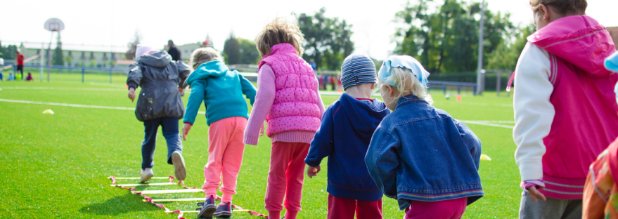 Children running in a field